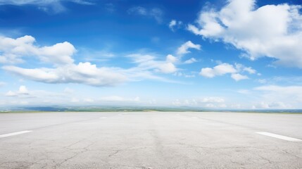 Fototapeta na wymiar Empty asphalt road and blue sky with white clouds. Road background with blue sky with clouds