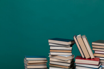 stack of books on a green background in the learning library