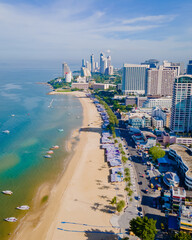 Fototapeta na wymiar Pattaya Thailand, a view of the beach road with hotels and skyscrapers buildings alongside the renovated new beach road. Drone aerial view of the beach of Pattaya