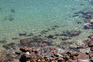 Rocky sea shore with turquoise water