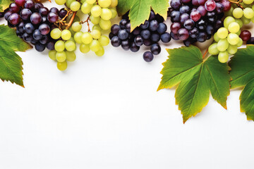 Bunch of ripe red and green grape with leaves on white wooden background top view. Background...
