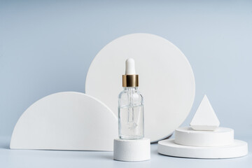 A transparent serum or gel in a dropper bottle on a white concret podium, product presentation,...