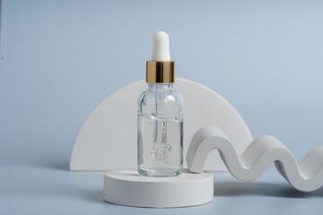 A transparent serum or gel in a dropper bottle on a white concret podium, product presentation, marketing showing