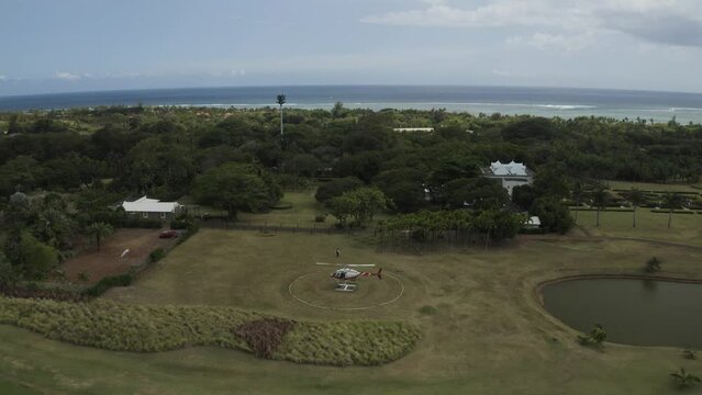 Aerial view of an helicopter flying over a tennis court in Bel Ombre, Savanne, Mauritius.