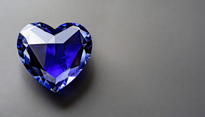 Fototapeta premium Indigo heart shaped diamond on grey background and copy space on a side 