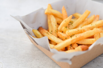 French fries, finger chips on white table background
