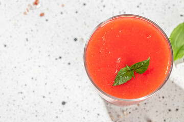 Tomato juice in the glass on a light background. Long banner format
