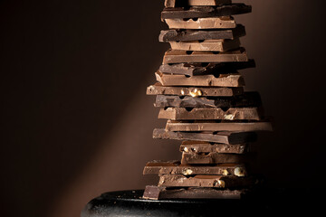 Chocolate tower, variety of different broken chocolate pieces
