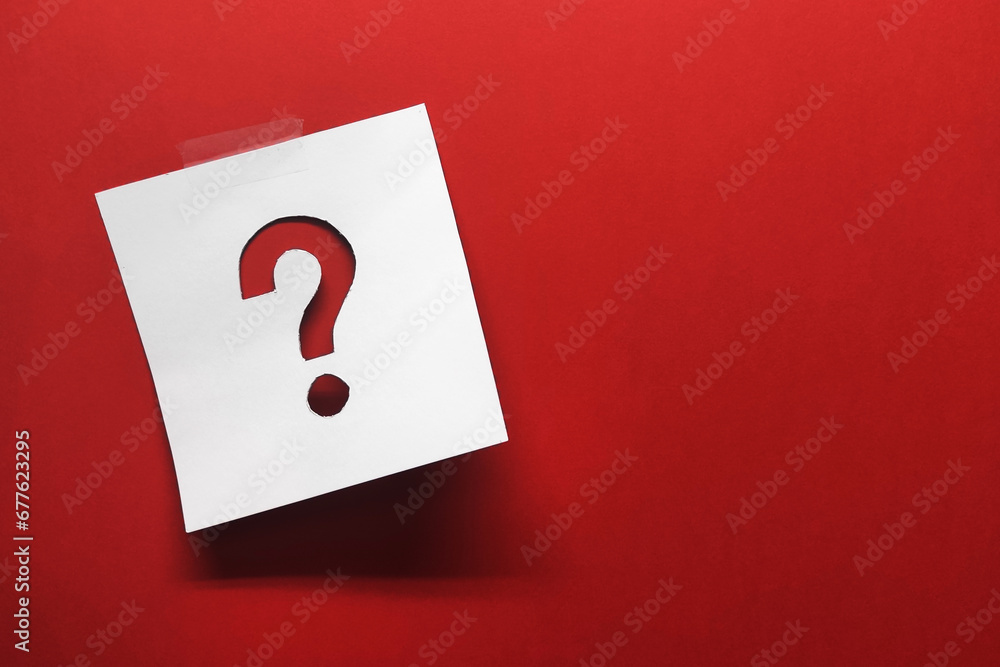 Poster note paper with question mark on red background