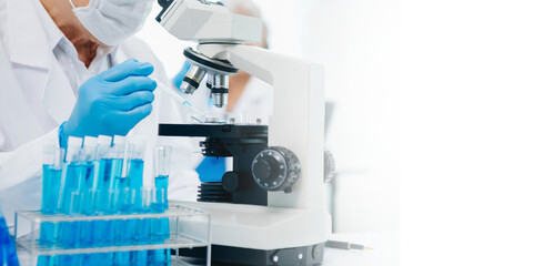 scientists conducting research investigations in a medical laboratory, a researcher in the...