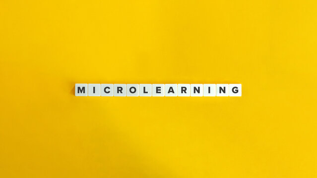 Microlearning or Microtraining Term. Letter Tiles on Orange Yellow Background. Minimal Aesthetics.