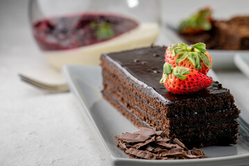 piece of sweet dessert on small dish plate for serve like chocolate strawberry cheesecake custard waffle and ice cream with berries on white mulberry paper.