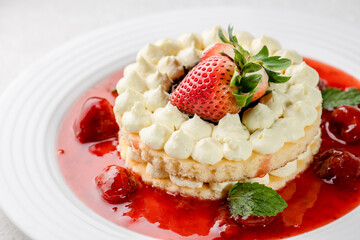 piece of sweet dessert on small dish plate for serve like chocolate strawberry cheesecake custard waffle and ice cream with berries on white mulberry paper.