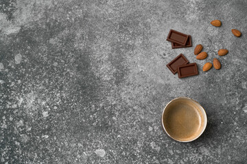 Ceramic cup, chocolate, wafer, marble background.