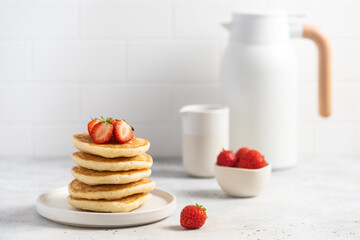 stack of pancakes with strawberries