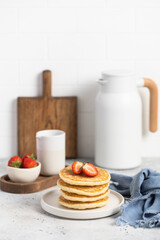 stack of pancakes with strawberries