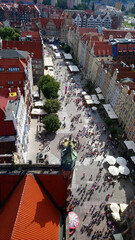 Extended combined description: Soak in the dynamic atmosphere of Gdańsk's main thoroughfare, teeming with life, as stunning architecture and a bird's-eye view of history unfold below © Єгор Городок