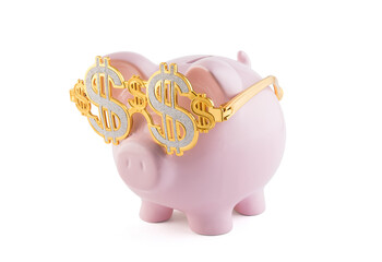 Pink piggy bank wearing golden glasses with dollar sign isolated on white background with clipping path