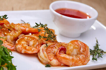shrimps with sauce on white plate