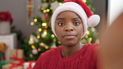 African american woman celebrating christmas taking selfie picture at home