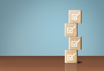 Checklists concept. check mark on wooden cubes