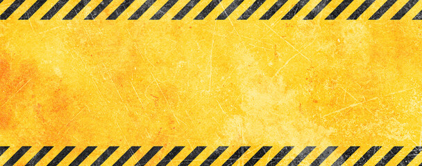 Grunge yellow and black diagonal stripes. black and yellow warning line striped background
