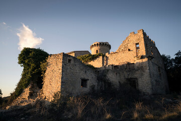 Castle of Clascar during Sunset at the Cliffs of Bertí with Slightly Cloudy Sky"