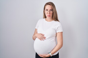 Young pregnant woman expecting a baby, touching pregnant belly depressed and worry for distress,...