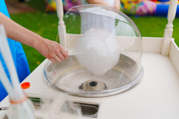 Making cotton candy at a children's party. 