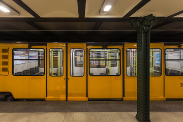 Yellow metro car in underground subway station on the M1 line - 677659814