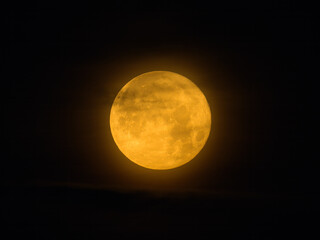 Yellow full moon in northern France in summer