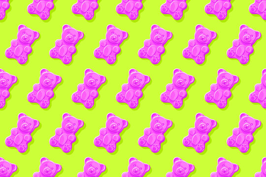 Pink gummy bears on bright green background. Seamless pattern. Texture for fabric, wallpaper, decorative print	