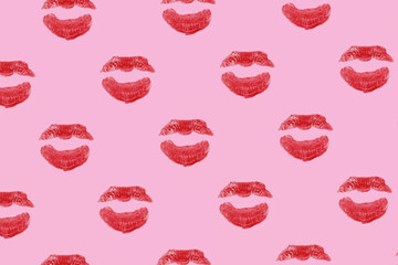 Red lipstick marks, creative love pattern, pink background. 