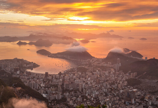 Panoramic view of Rio de Janeiro at sunset, view of the Pao de Acucar (Sugar Loaf Mountain) and Botafogo bay, Brazil.
