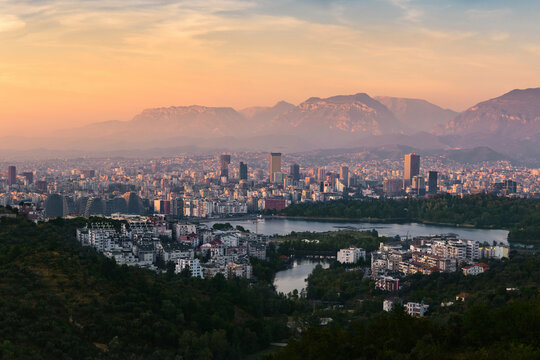 Fototapeta Aerial panorama view of Tirana at sunset, the capital city in Albania.