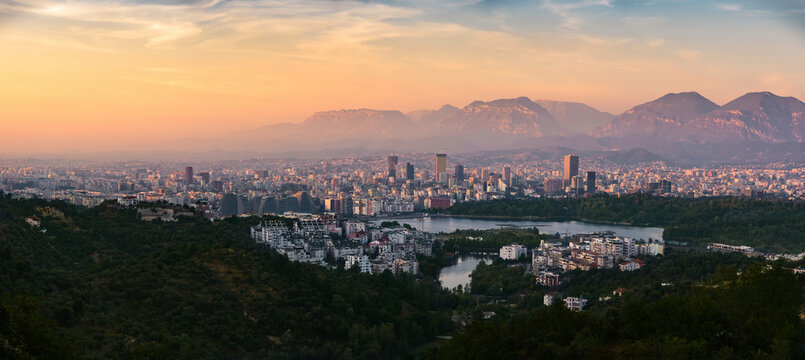 Fototapeta Aerial panorama view of Tirana at sunset, the capital city in Albania.