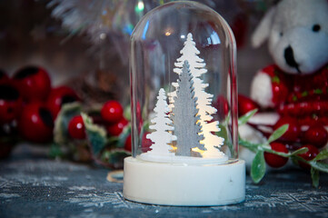 Happy New Year. Christmas shopping sale. Xmas tree decoration. Santa Claus. Decorated Christmas tree. Christmas composition. Decorations at fireplace with lights. New Year holiday. Snowglobe