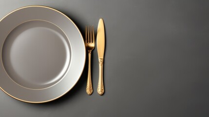 Top view of empty plate and gold cutlery on gray background,Details on the dining table - obrazy, fototapety, plakaty