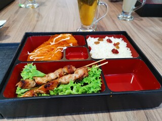 Skewer served in bento box