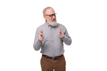 Naklejka premium a handsome old man with a mustache and a beard in glasses is dressed in a shirt and trousers on a white background