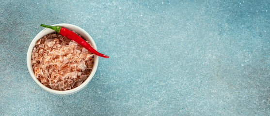 paprika salt, sea salt, pepper in bowl on a blue background. Long banner format. top view. copy...