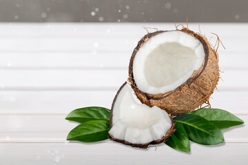 Tasty fresh coconut with slice on desk