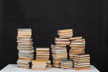learning library science stack of books on a black background