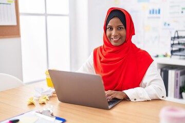 Young beautiful woman business worker using laptop working at office