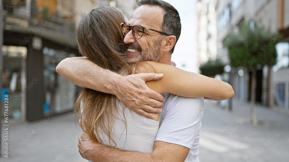 Sticker confident father hugging his smiling daughter on a sunny street, sharing joy and happiness together