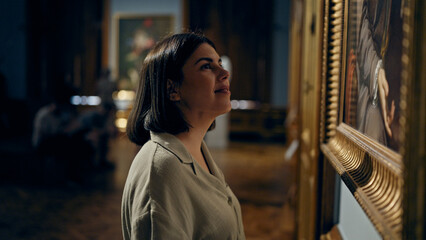 Young beautiful hispanic woman visiting art gallery at Belvedere Palace in Vienna