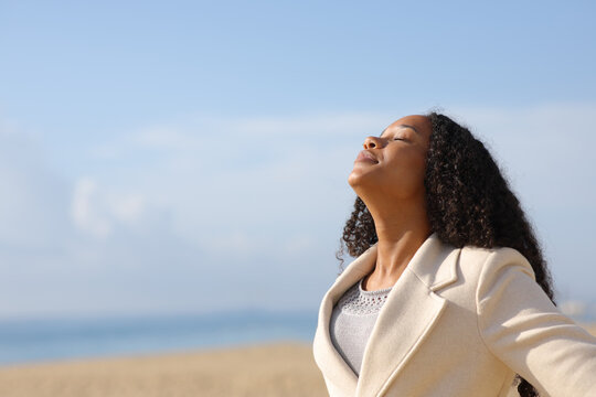 Black Woman Breathing In Winter On The Beach