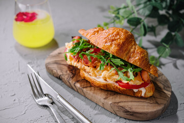 Fresh sandwich with bacon and scrambled eggs