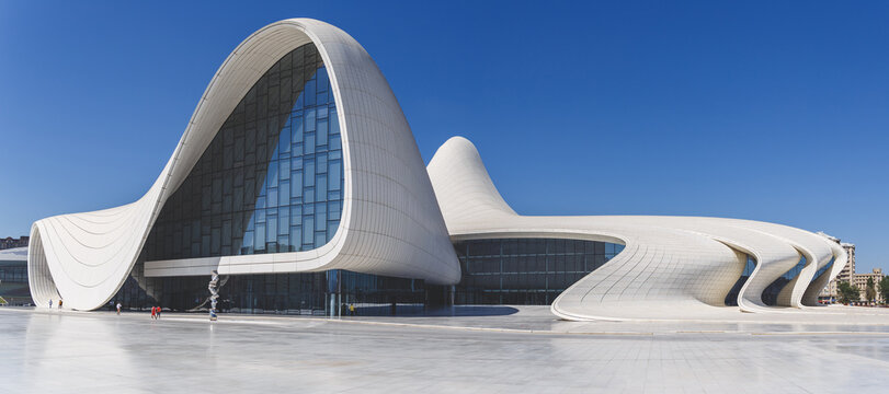 Baku, Azerbaijan - August 11, 2023: Exterior view of Heydar Aliyev Complex building. Building designed by Zaha Hadid. Center houses a conference hall, gallery and museum. 