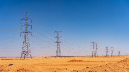 Tall power transmission lines in the desert